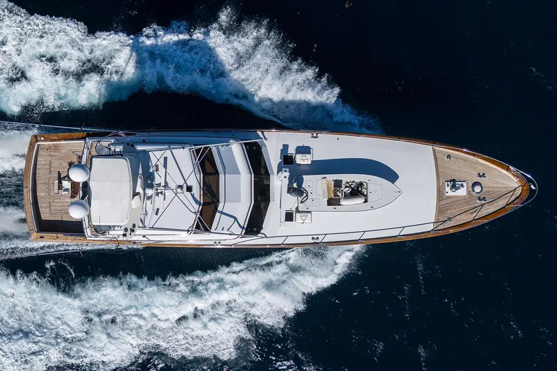 Slide: The Image of Aerial view of 1985 Feadship Yacht Fisherman cruising on open water. - 146