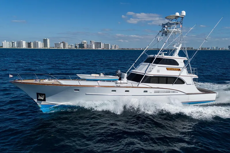 Slide: The Image of 1985 Feadship Yacht Fisherman cruising on ocean near city skyline. - 150