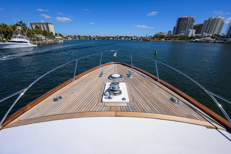 Slide: The Image of Bow view of 1985 Feadship Yacht Fisherman cruising in a scenic waterway. - 18