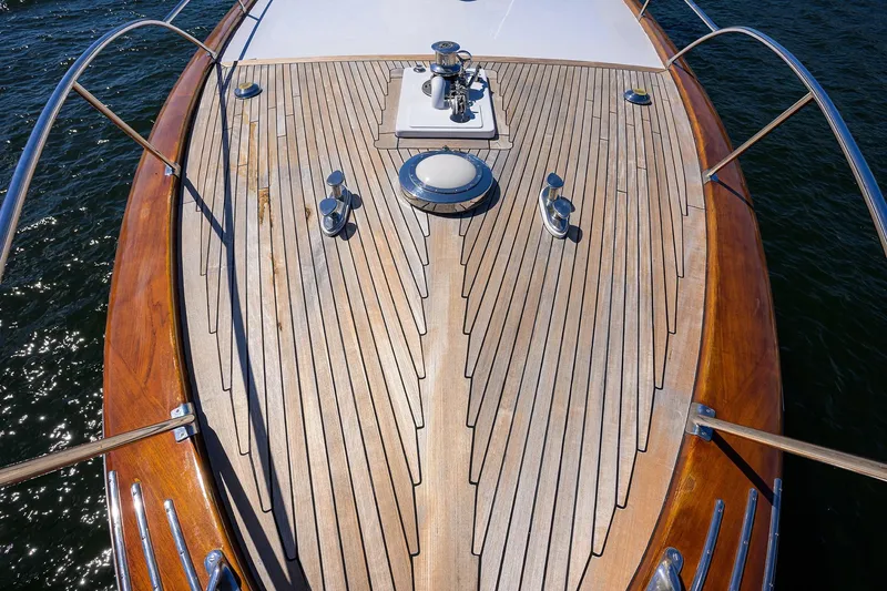 Slide: The Image of 1985 Feadship Yacht Fisherman deck with teak wood finish and chrome fittings. - 20