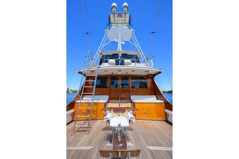 Slide: The Image of 1985 Feadship Yacht Fisherman with wooden deck and tower against clear blue sky. - 25