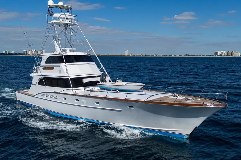 Slide: The Image of 1985 Feadship Yacht Fisherman cruising on open sea under clear blue sky. - 3