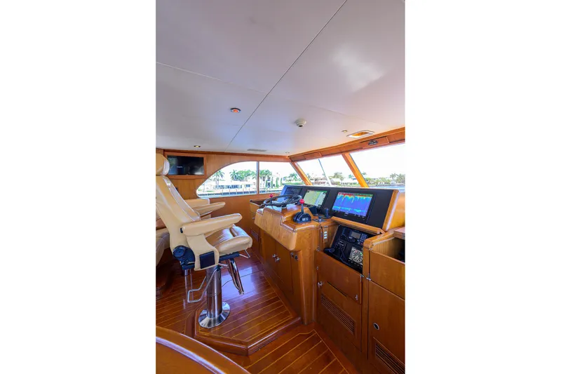 Slide: The Image of Luxurious 1985 Feadship Yacht Fisherman helm with modern navigation equipment and leather seating. - 32