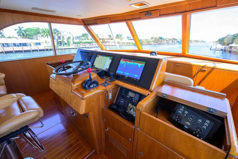 Slide: The Image of 1985 Feadship Yacht Fisherman helm with navigation screens and wooden interior. - 33