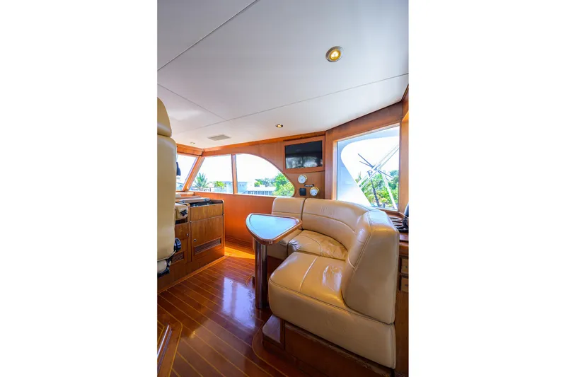 Slide: The Image of Luxurious interior of 1985 Feadship Yacht Fisherman with leather seating and wooden accents. - 34