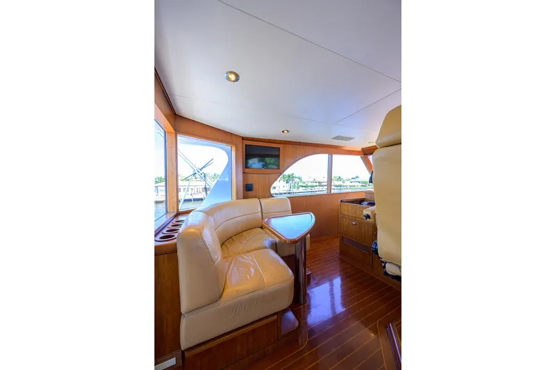 Slide: The Image of Luxurious 1985 Feadship Yacht Fisherman interior with leather seating and wooden finishes. - 39