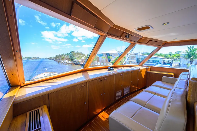 Slide: The Image of Luxurious interior of 1985 Feadship Yacht Fisherman with panoramic windows and plush seating. - 45