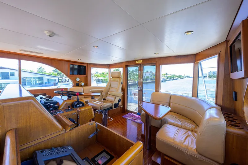 Slide: The Image of Luxurious interior of 1985 Feadship Yacht Fisherman with leather seating and wooden accents. - 46