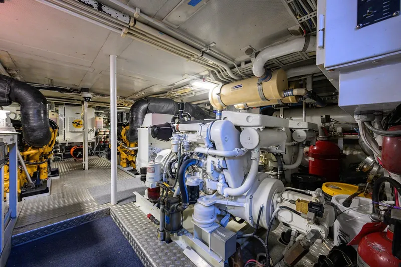 Slide: The Image of Engine room of a 1985 Feadship Yacht Fisherman, showcasing machinery and equipment. - 58