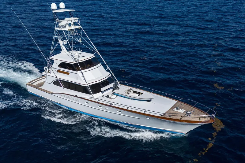 Slide: The Image of 1985 Feadship Yacht Fisherman cruising on open sea, showcasing elegant design and craftsmanship. - 6