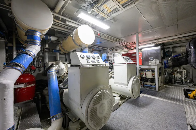 Slide: The Image of Engine room of 1985 Feadship Yacht Fisherman with machinery and piping. - 60