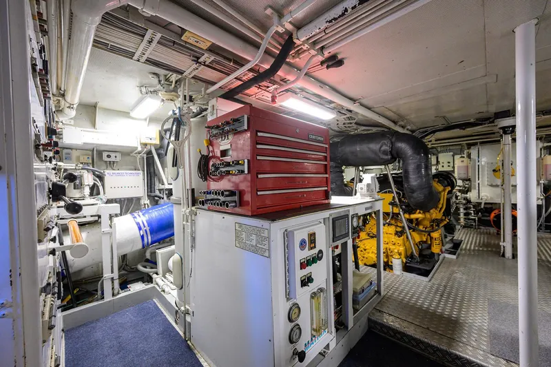 Slide: The Image of Engine room of 1985 Feadship Yacht Fisherman with tools and machinery. - 62