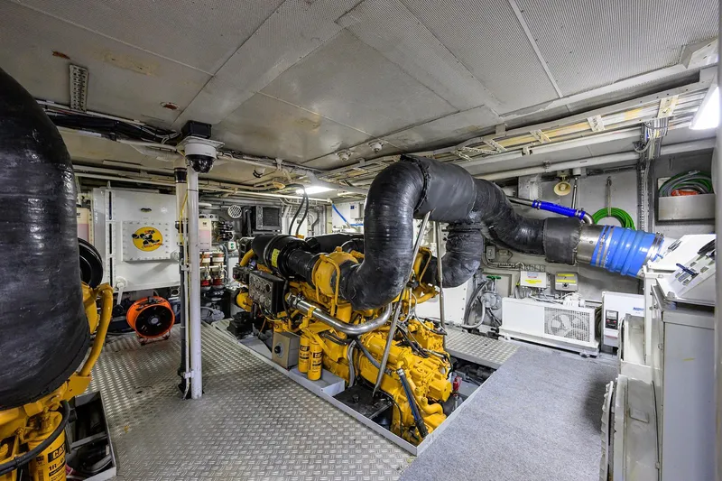 Slide: The Image of Engine room of 1985 Feadship Yacht Fisherman, featuring machinery and equipment. - 64