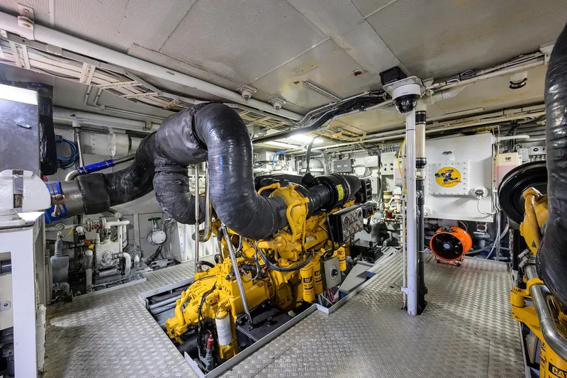 Slide: The Image of Engine room of 1985 Feadship Yacht Fisherman, featuring complex machinery and equipment. - 66