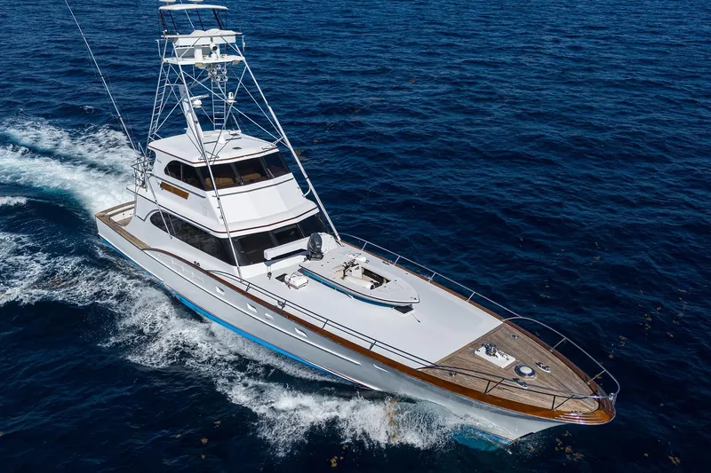 Slide: The Image of 1985 Feadship Yacht Fisherman cruising on open sea, showcasing elegant design and craftsmanship. - 7