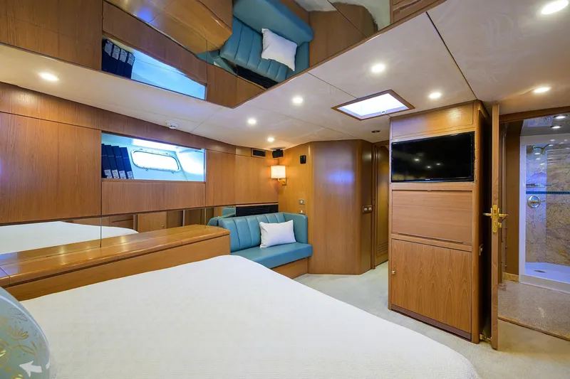 Slide: The Image of Luxurious 1985 Feadship Yacht Fisherman cabin with wood paneling and modern amenities. - 80