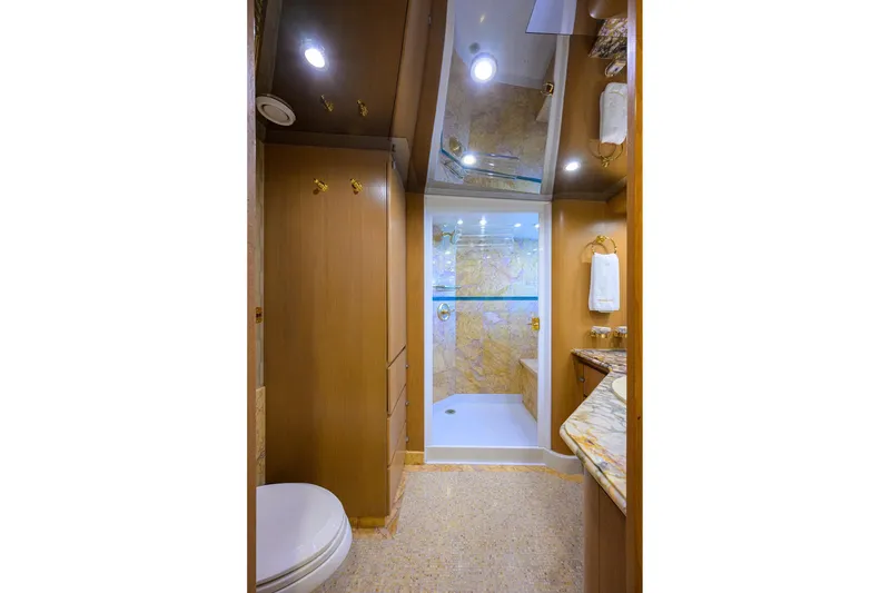 Slide: The Image of Luxurious bathroom on 1985 Feadship Yacht Fisherman with marble accents and modern fixtures. - 82