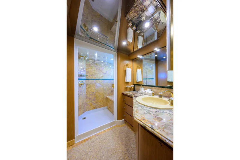 Slide: The Image of Luxurious 1985 Feadship Yacht Fisherman bathroom with marble countertops and elegant shower. - 83