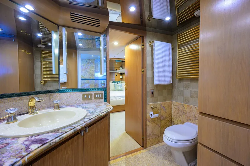 Slide: The Image of Luxurious bathroom on 1985 Feadship Yacht Fisherman with marble countertop and elegant fixtures. - 87