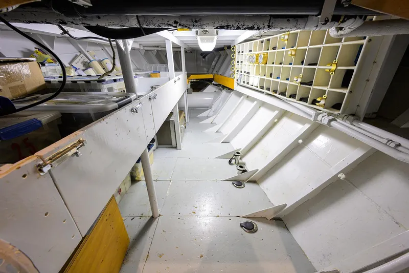 Slide: The Image of Interior of 1985 Feadship Yacht Fisherman, showcasing storage and structural details. - 89