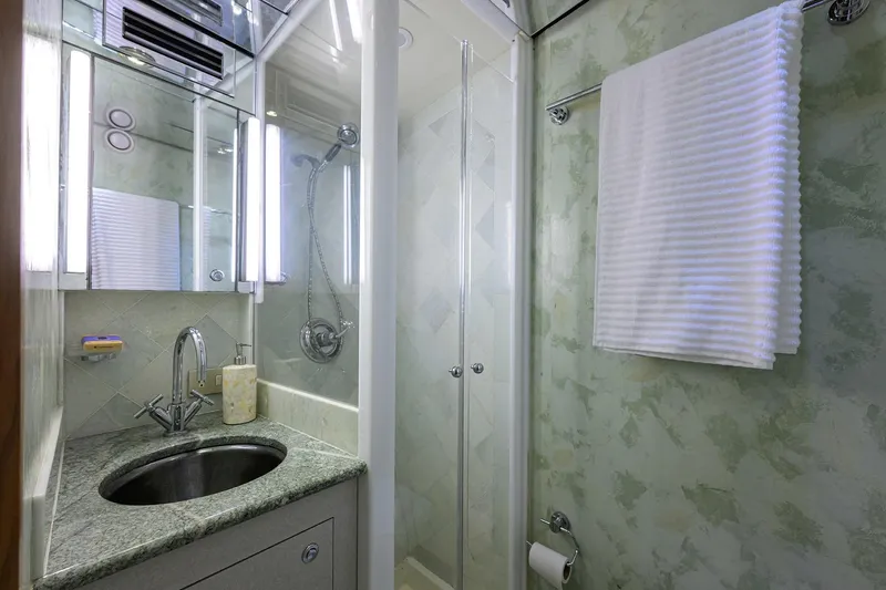 Slide: The Image of Luxurious bathroom in 1985 Feadship Yacht Fisherman with modern fixtures and elegant design. - 96