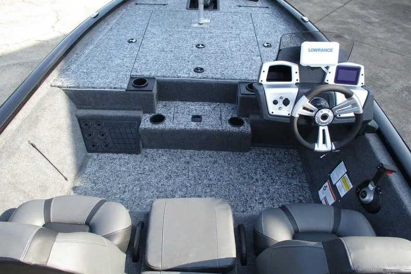 Slide: The Image of 2026 Tracker Pro Team 195 Tournament Edition boat interior with steering console and seating. - 9