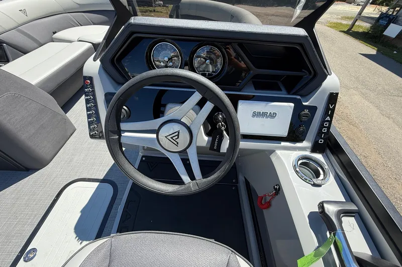 Slide: The Image of Steering console of 2026 Viaggio LOGO Z22S-CC boat with Simrad display and controls. - 7