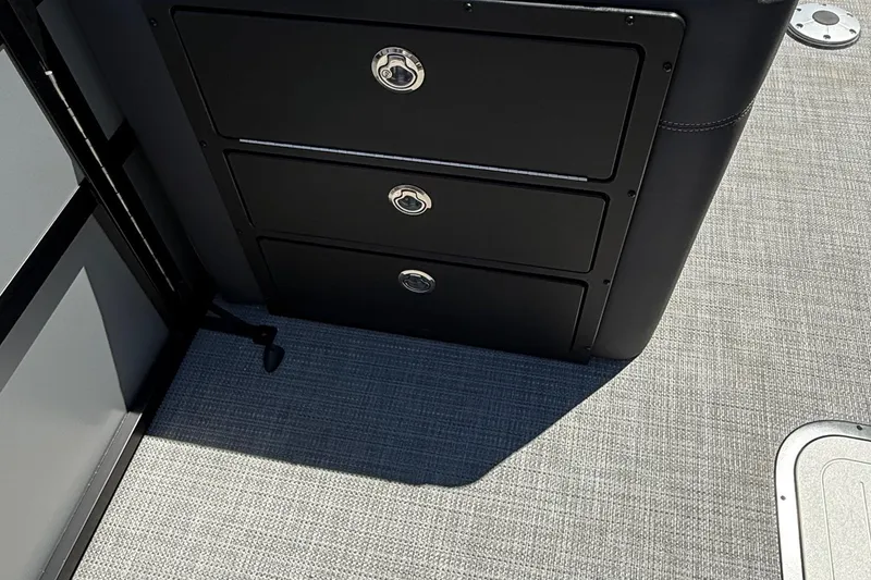 Slide: The Image of Black storage drawers on Viaggio LOGO Z22S-CC boat, 2026 model, with gray flooring. - 9