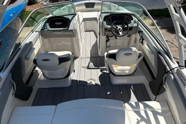 Slide: The Image of 2023 Chaparral 21 SSi boat interior with modern seating and steering console. - 5