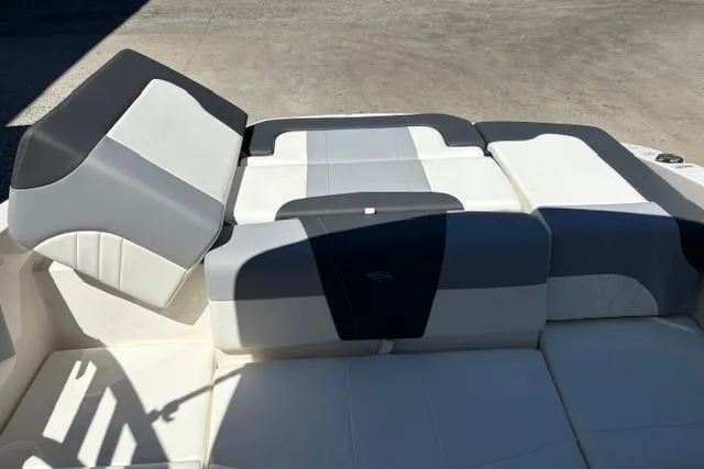 Slide: The Image of 2023 Chaparral 21 SSi boat interior with gray and white cushioned seating. - 7
