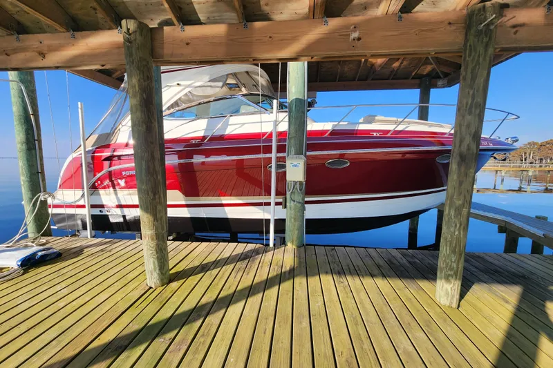 Slide: The Image of 2015 Formula 34 Performance Cruiser docked under wooden shelter. - 11