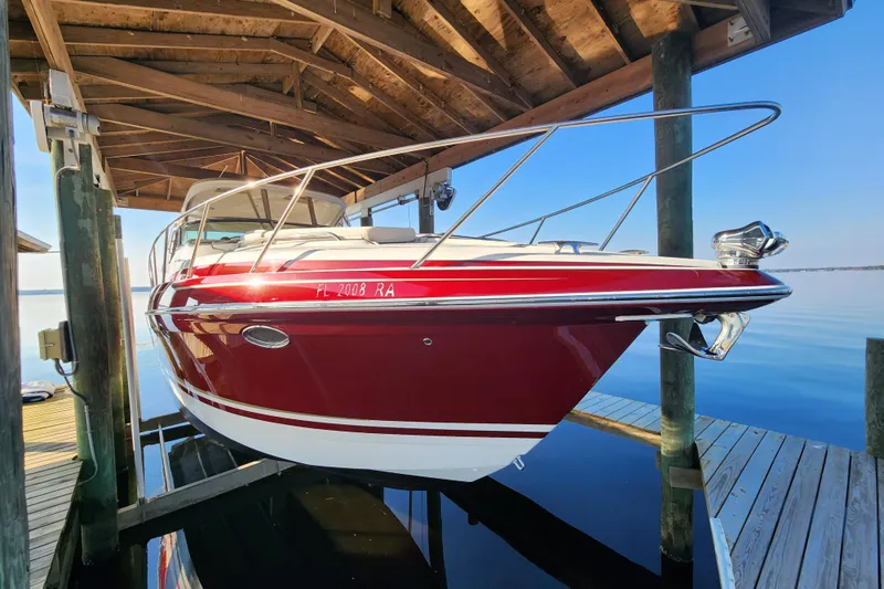 Slide: The Image of 2015 Formula 34 Performance Cruiser docked under wooden shelter. - 12