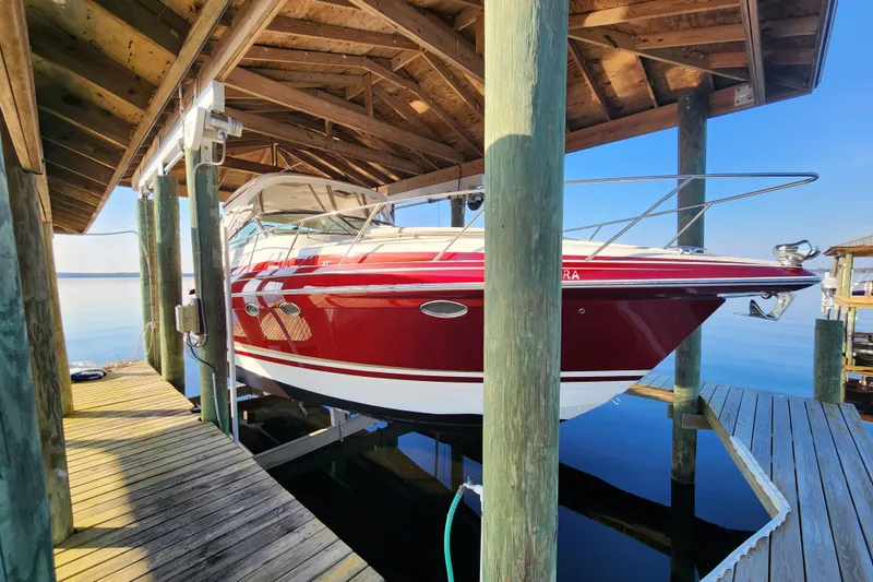 Slide: The Image of 2015 Formula 34 Performance Cruiser docked under wooden shelter. - 14