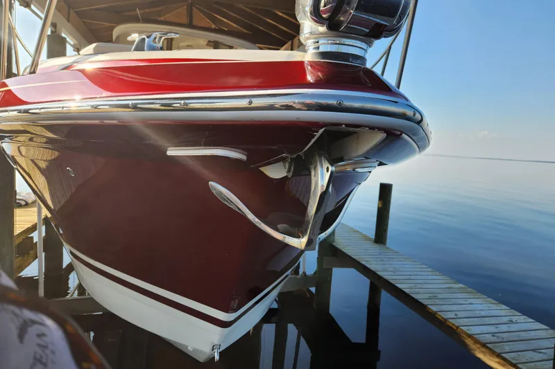 Slide: The Image of 2015 Formula 34 Performance Cruiser docked, showcasing sleek red and white hull design. - 17