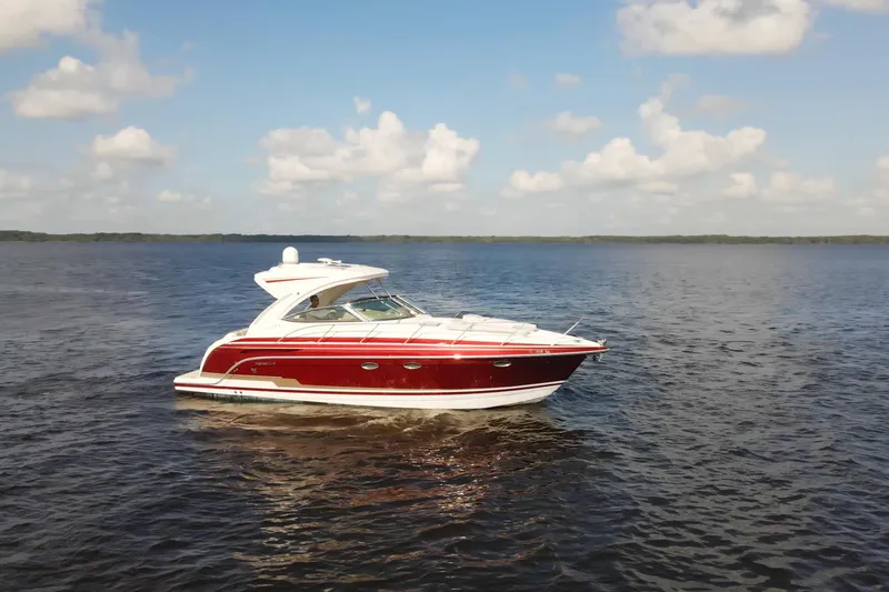 Slide: The Image of 2015 Formula 34 Performance Cruiser on calm water under a partly cloudy sky. - 2
