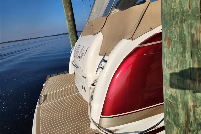 Slide: The Image of 2015 Formula 34 Performance Cruiser docked, featuring sleek red and white design. - 21