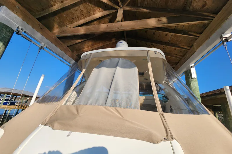 Slide: The Image of 2015 Formula 34 Performance Cruiser under wooden dock shelter, clear blue sky. - 29