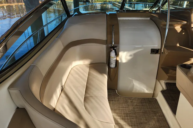 Slide: The Image of Interior of 2015 Formula 34 Performance Cruiser with beige seating and fire extinguisher. - 38