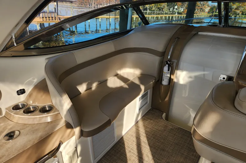 Slide: The Image of 2015 Formula 34 Performance Cruiser interior with beige seating and cup holders. - 39