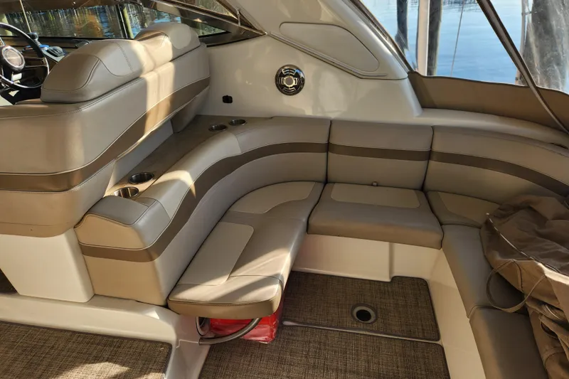 Slide: The Image of 2015 Formula 34 Performance Cruiser interior with beige seating and cup holders. - 42