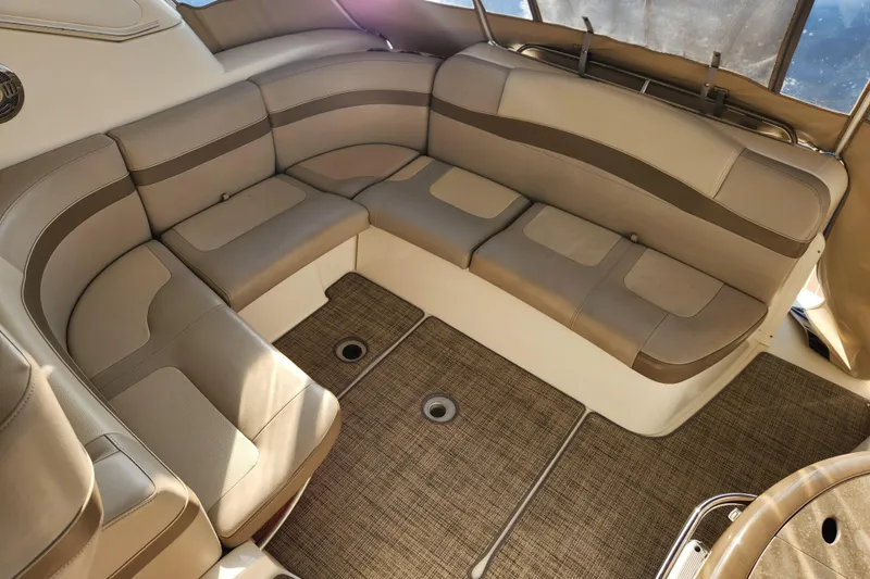 Slide: The Image of 2015 Formula 34 Performance Cruiser interior with beige seating and carpeted flooring. - 43