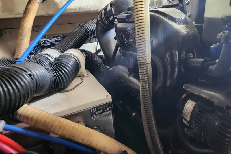 Slide: The Image of Engine compartment of a 2015 Formula 34 Performance Cruiser with visible hoses and components. - 51