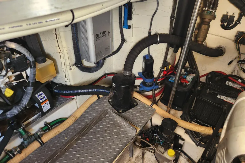 Slide: The Image of 2015 Formula 34 Performance Cruiser engine room with battery charger and wiring. - 54