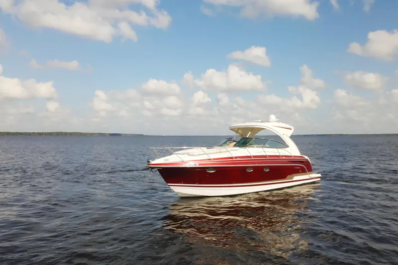 Slide: The Image of 2015 Formula 34 Performance Cruiser on open water under a partly cloudy sky. - 6
