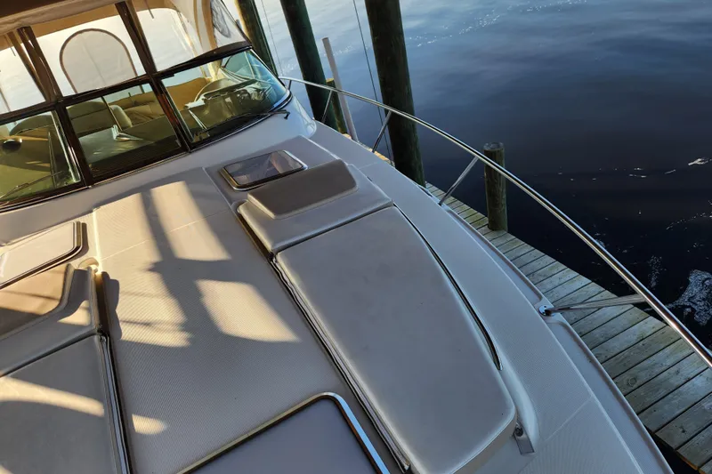 Slide: The Image of 2015 Formula 34 Performance Cruiser docked, showcasing sleek deck design and luxurious seating. - 60