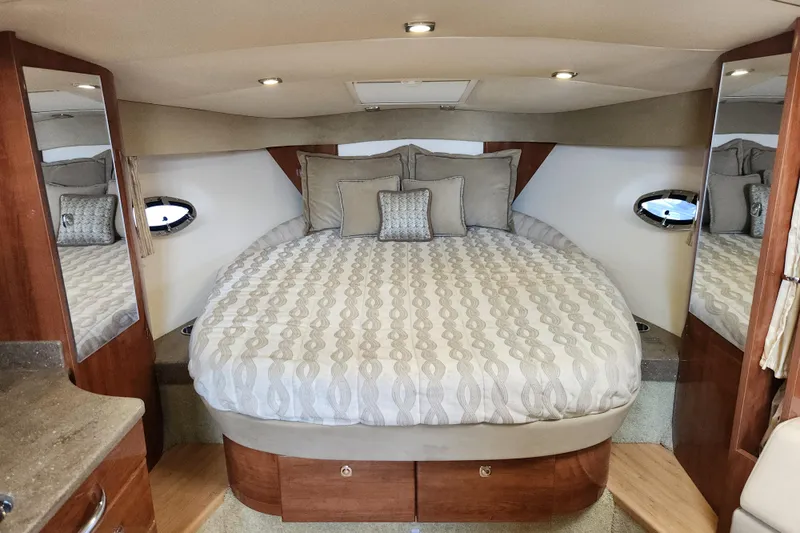 Slide: The Image of Luxurious cabin interior of 2015 Formula 34 Performance Cruiser with elegant bedding and wood accents. - 66