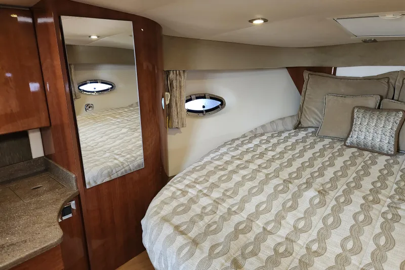 Slide: The Image of 2015 Formula 34 Performance Cruiser interior with bed, mirror, and porthole window. - 67