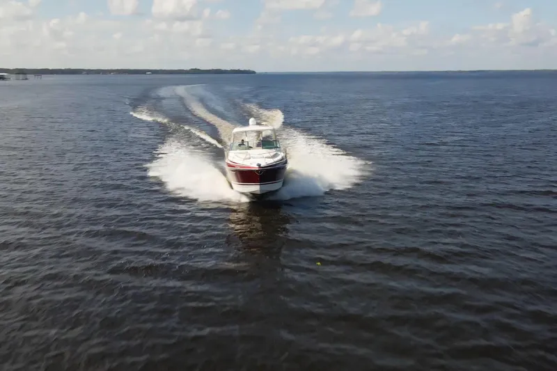 Slide: The Image of 2015 Formula 34 Performance Cruiser speeding on open water under a clear sky. - 7