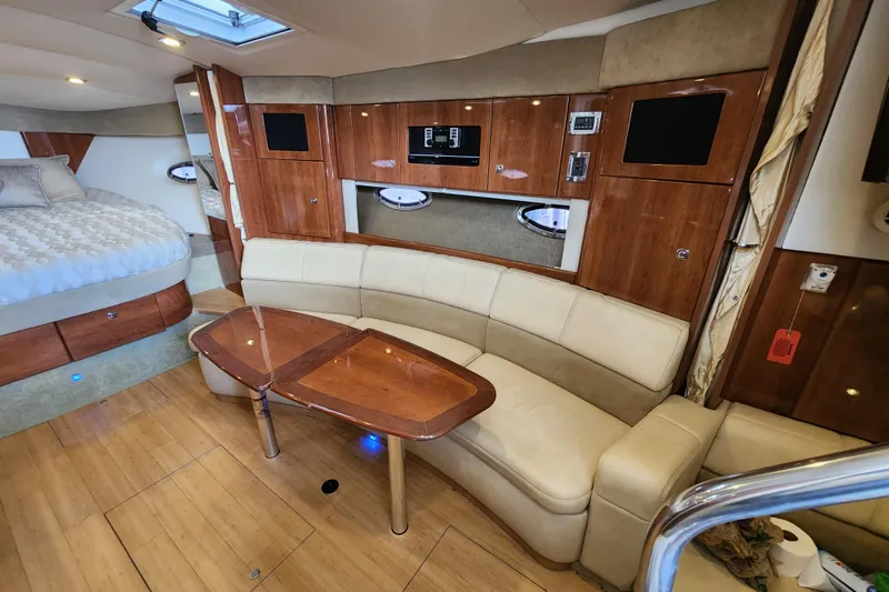 Slide: The Image of 2015 Formula 34 Performance Cruiser interior with wood accents and cozy seating area. - 72
