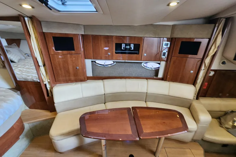 Slide: The Image of 2015 Formula 34 Performance Cruiser interior with wood cabinetry and cream seating. - 73